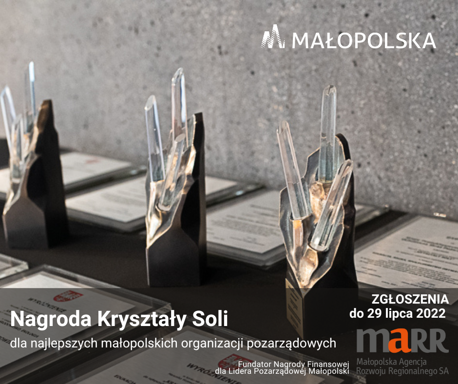 Zdjęcie przedstawia statuetki, logo województwa małopolskiego i informacje o konkursie.